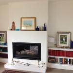 New plaster fire place and timber bookcases